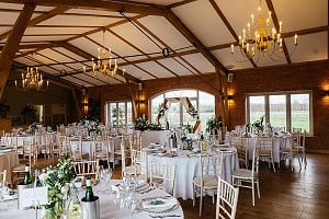 Barn set out with round tables