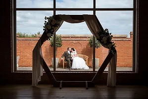 The couple on the bench through the window