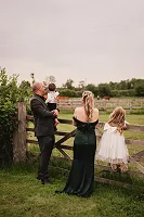 A family looking at the horses